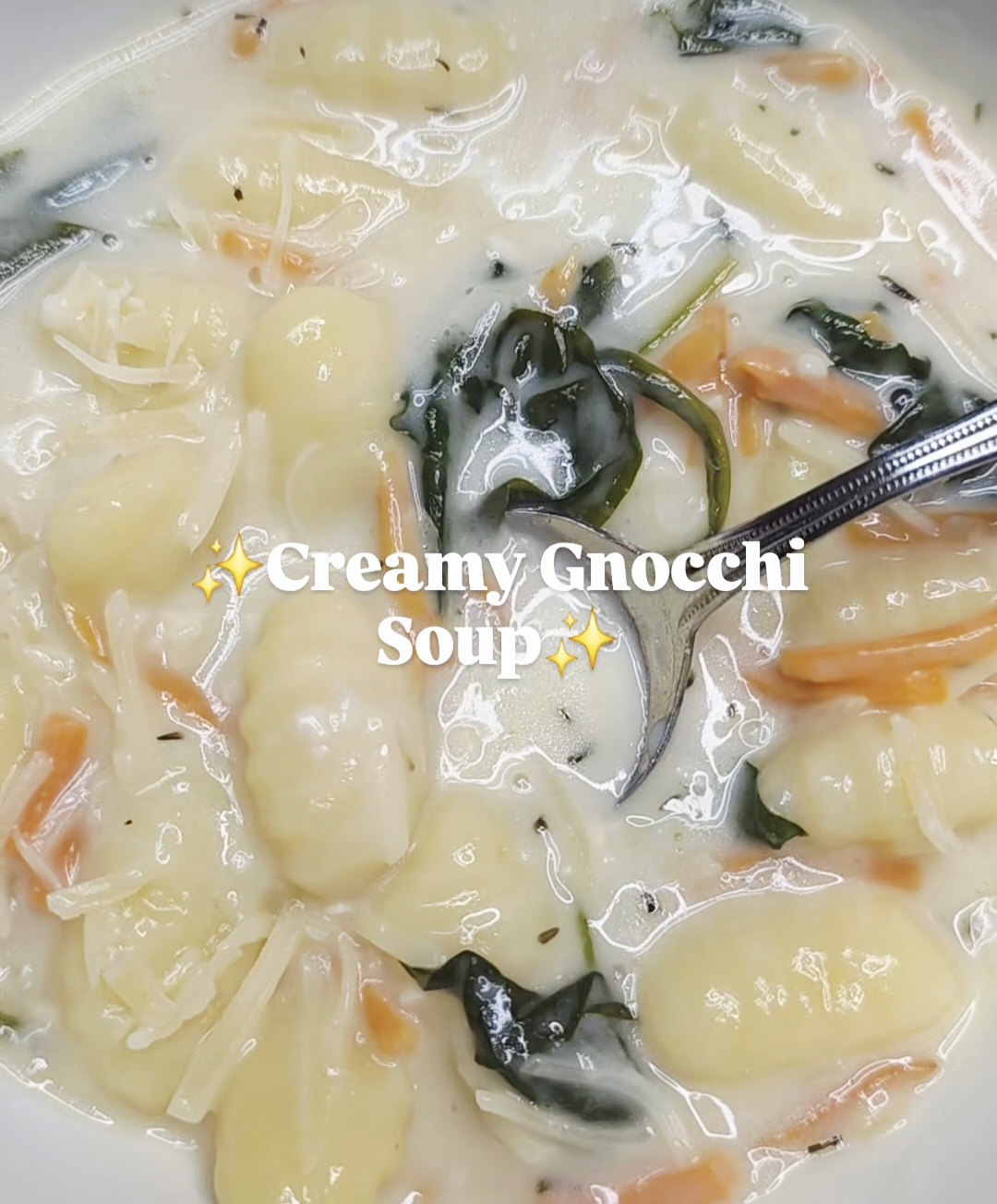 Bowl of creamy gnocchi soup with carrots, spinach, and Parmesan